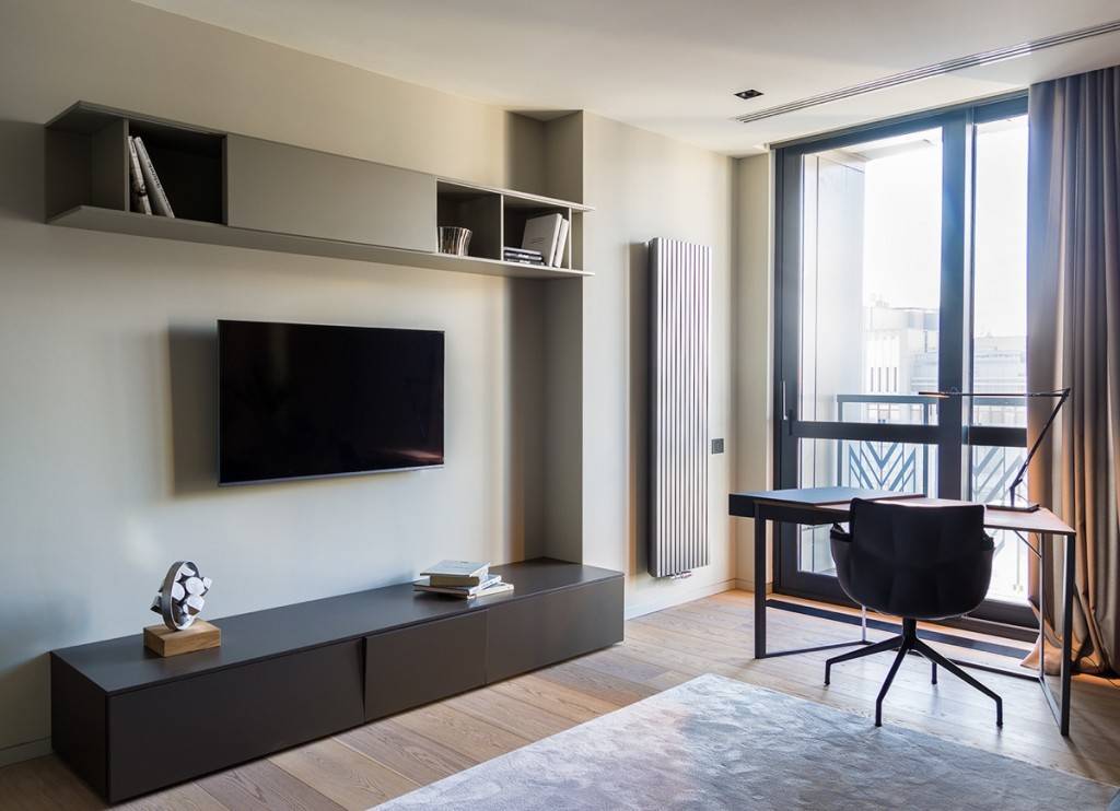 Современные стенки (58 фото): выбираем модные варианты в комнату, стильные новинки 2021 года для гостиной и в однокомнатную квартиру